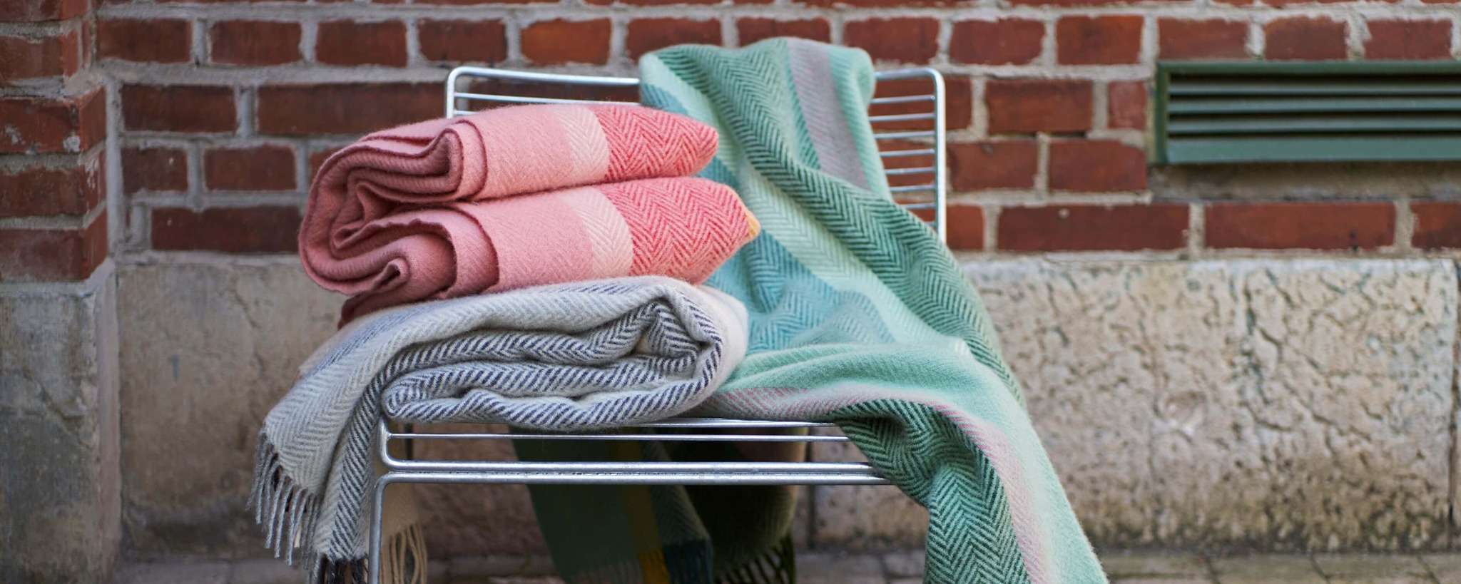 Klippan Birka Blankets on a metal outdoor chair