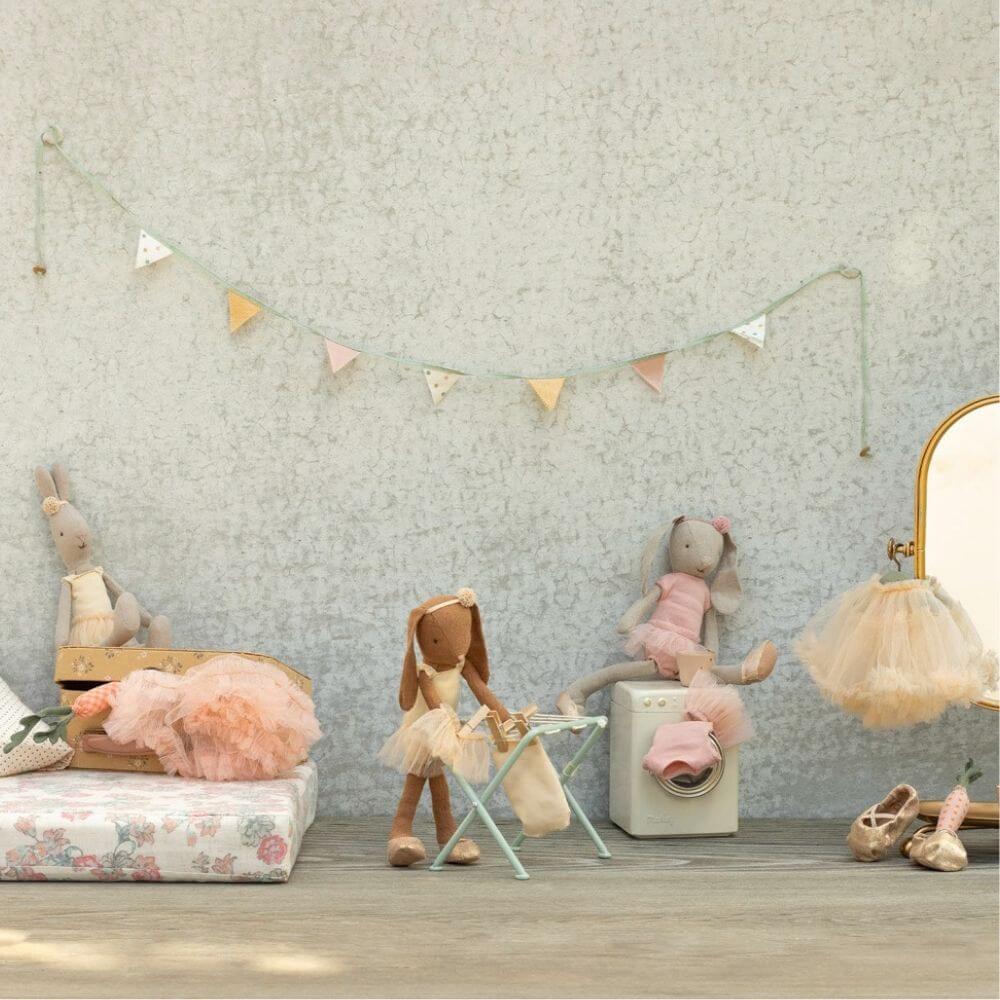 A selection of Maileg bunnies & rabbits with accessories including a washing machine, clothes dryer and suitcase