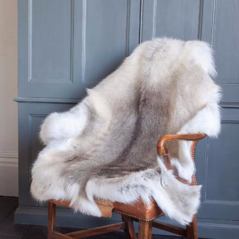 Reindeer Hide drapped on a wooden chair